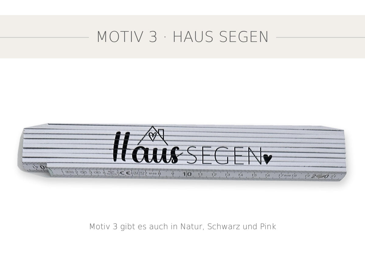 Weißer Meterstab mit Motiv 3 Haus SEGEN mit Dach und Herz, freigestellt auf weißem Hintergrund